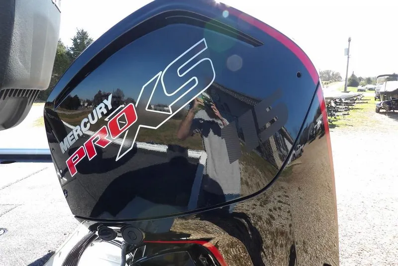 Slide: The Image of Mercury Pro XS engine on 2026 Lund 1875 Renegade boat, reflecting outdoor scenery. - 47