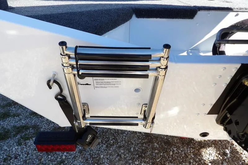 Slide: The Image of 2026 Lund 1875 Renegade boat ladder detail, featuring stainless steel construction and secure mounting. - 50