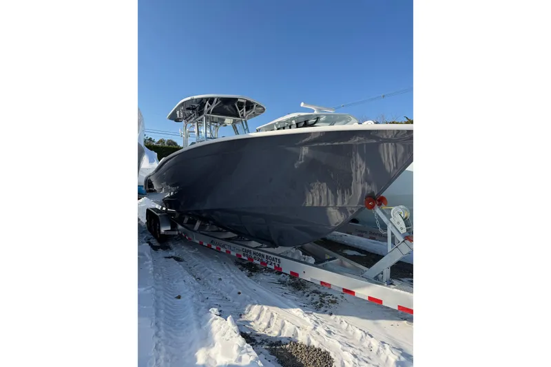 The Image of 2026 Cape Horn 32 XS boat on trailer in snow. - 0