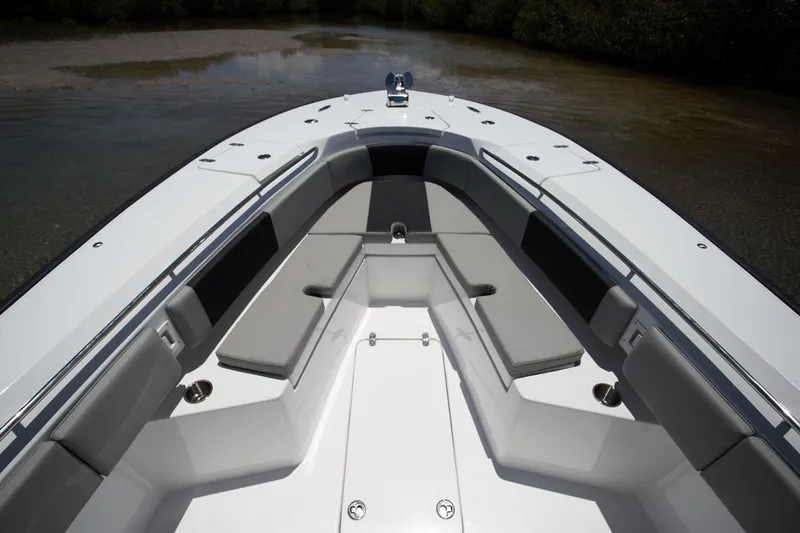 Slide: The Image of Manufacturer Provided Image: Bow view of 2026 Cape Horn 32 XS boat with cushioned seating. - 3