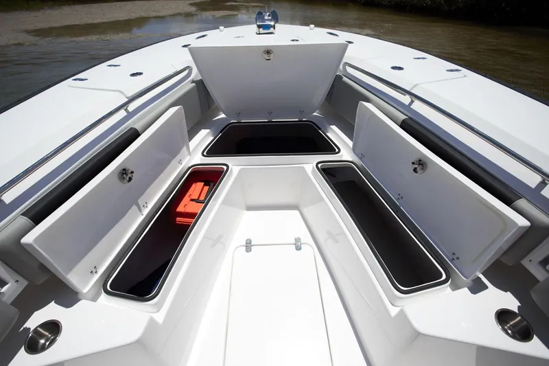 Slide: The Image of Manufacturer Provided Image: 2026 Cape Horn 32 XS boat with open storage compartments on deck. - 5