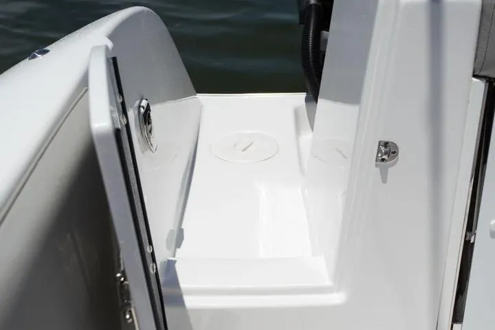 Slide: The Image of 2026 Cape Horn 32 XS boat interior with modern seating and fishing rod holders. - 10