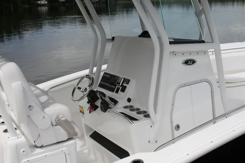 Slide: The Image of 2026 Cape Horn 32 XS boat interior with gray seating and modern design. - 6