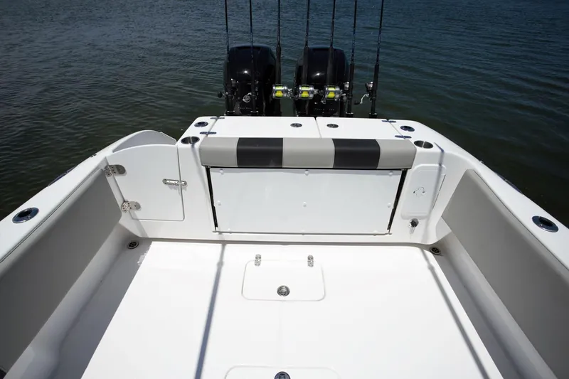 Slide: The Image of 2026 Cape Horn 32 XS boat interior with gray seating and storage compartments. - 8