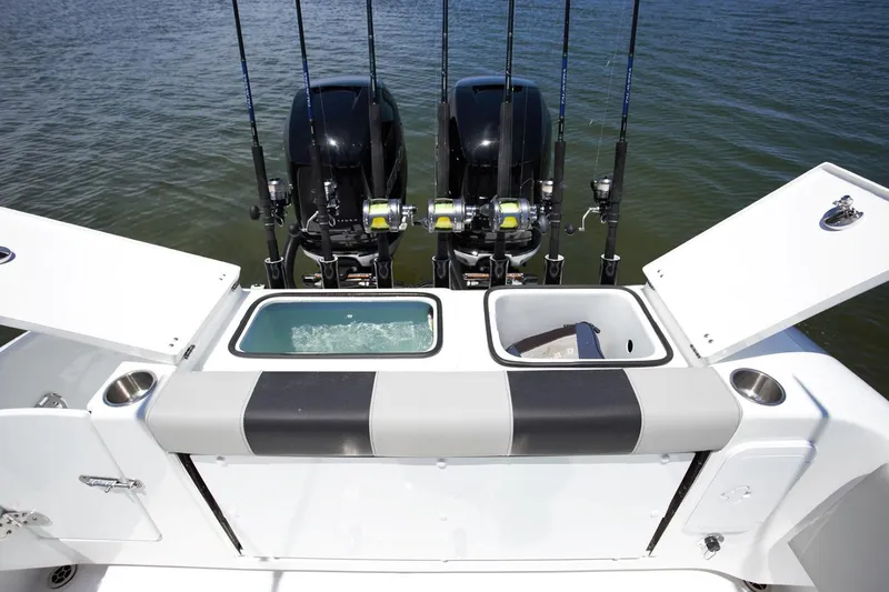 Slide: The Image of 2026 Cape Horn 32 XS boat interior with gray seating and cup holders. - 9