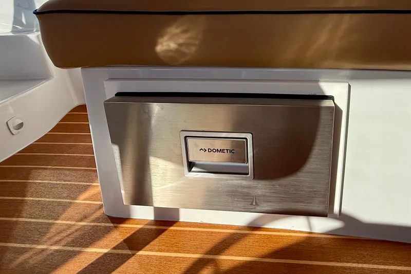 Slide: The Image of Dometic appliance on 2022 Duffy Suncruiser 22 boat with wooden flooring. - 11