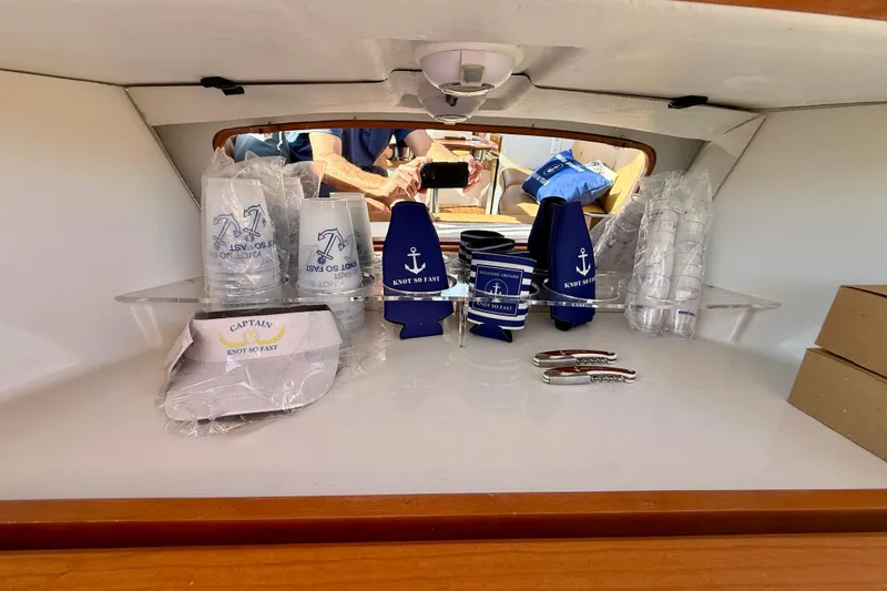 Slide: The Image of Interior of 2022 Duffy Suncruiser 22 with nautical-themed accessories and drinkware. - 12