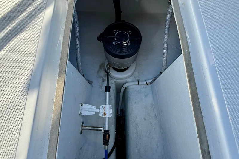 Slide: The Image of 2022 Duffy Suncruiser 22 boat interior showing mechanical components and wiring. - 16