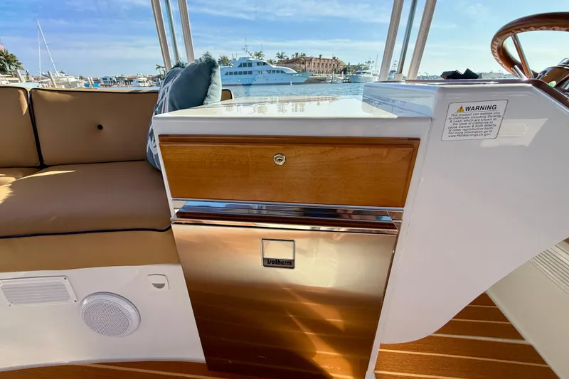 Slide: The Image of Interior of 2022 Duffy Suncruiser 22 boat with seating and control panel. - 9