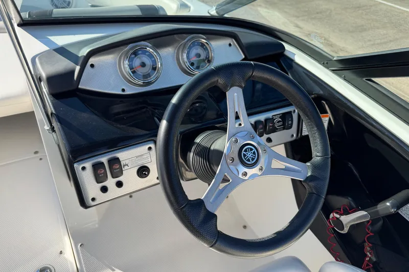 Slide: The Image of 2013 Yamaha Boats AR192 steering wheel and dashboard close-up. - 11