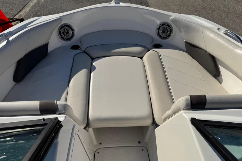 Slide: The Image of 2013 Yamaha Boats AR192 interior with cushioned seating and built-in speakers. - 15