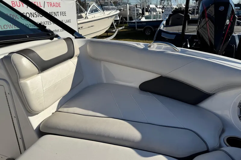 Slide: The Image of 2013 Yamaha Boats AR192 interior seating with white and black upholstery. - 17