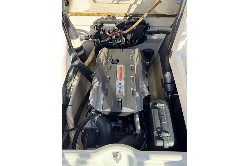 Slide: The Image of 2013 Yamaha Boats AR192 engine compartment with visible components and wiring. - 20