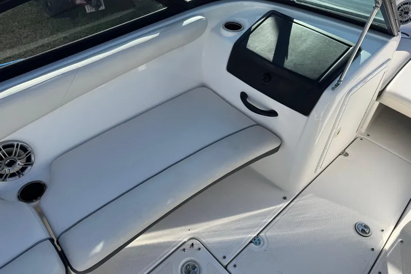 Slide: The Image of 2013 Yamaha Boats AR192 interior with white seating and speaker detail. - 9