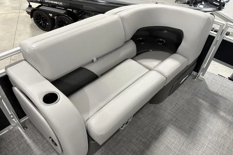 Slide: The Image of 2026 Sun Tracker SportFish 22 DLX boat interior with gray cushioned seating and cup holders. - 10