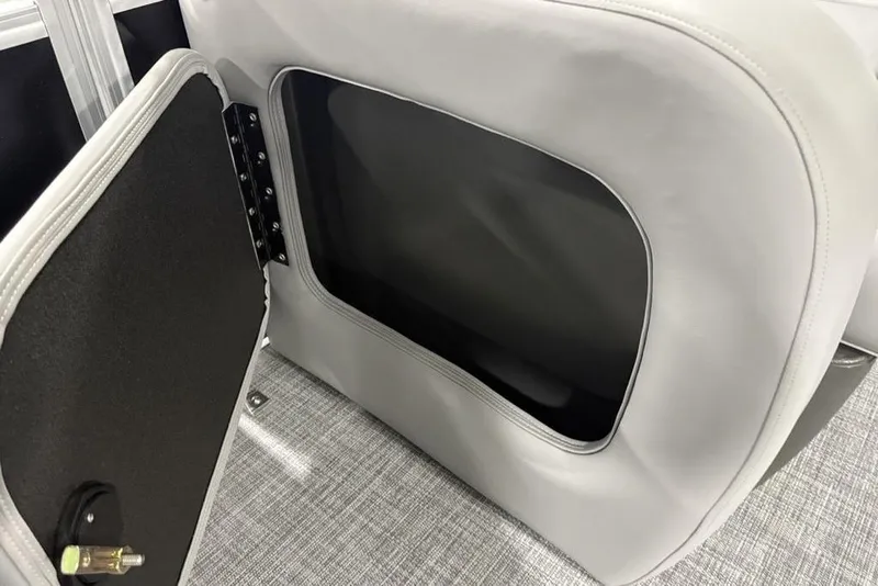 Slide: The Image of 2026 Sun Tracker SportFish 22 DLX boat storage compartment with open hatch. - 12