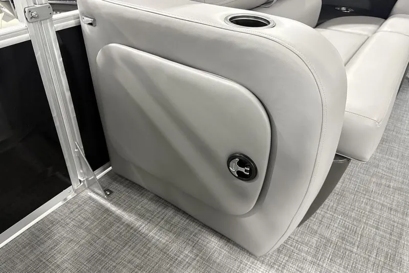 Slide: The Image of 2026 Sun Tracker SportFish 22 DLX boat interior with gray seating and cup holder. - 15