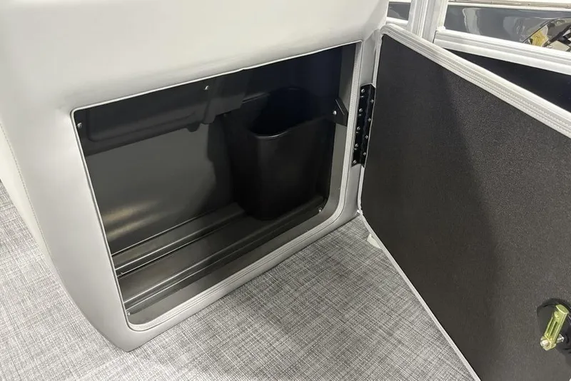 Slide: The Image of Open storage compartment in 2026 Sun Tracker SportFish 22 DLX boat. - 20