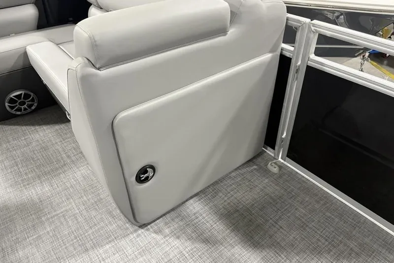 Slide: The Image of 2026 Sun Tracker SportFish 22 DLX boat interior with gray seating and flooring. - 21
