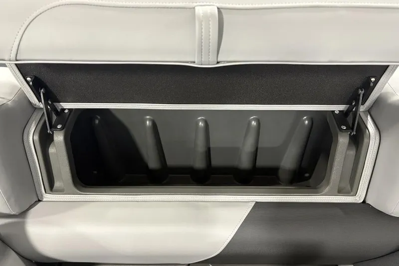 Slide: The Image of 2026 Sun Tracker SportFish 22 DLX boat seat storage compartment, open and empty. - 29