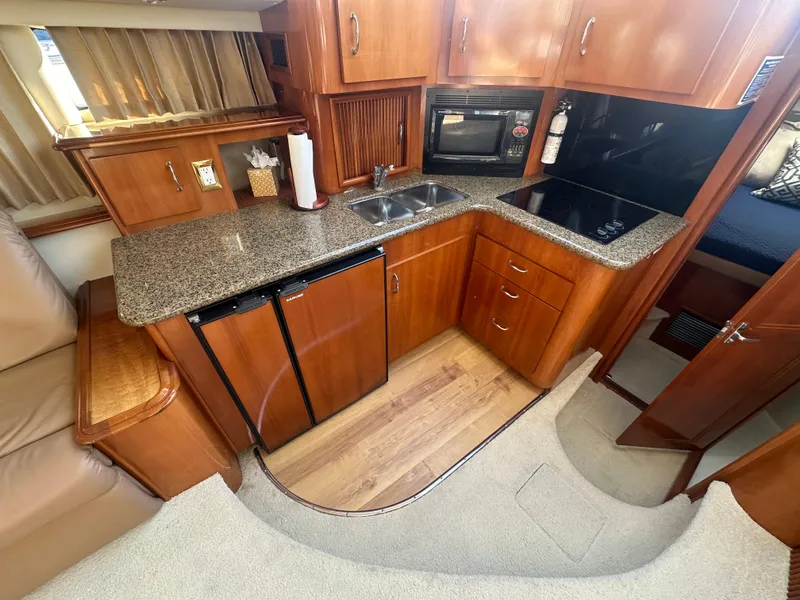 Slide: The Image of Interior view of 2004 Carver 396 Motor Yacht kitchen. - 14