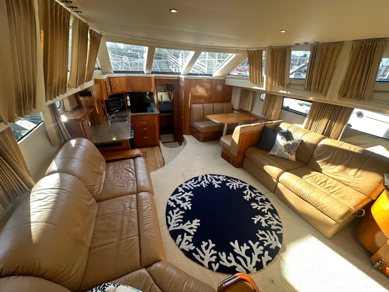 Slide: The Image of Interior of 2004 Carver 396 Motor Yacht with leather sofas and carpet. - 9