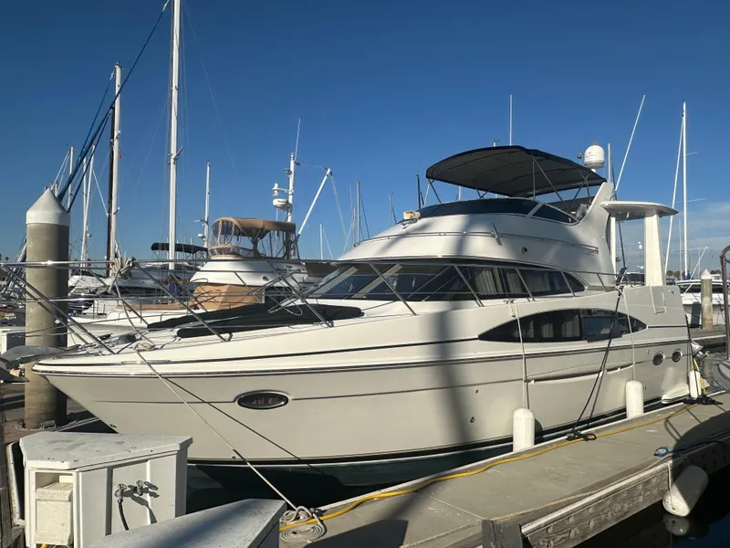 Slide: The Image of 2004 Carver 396 Motor Yacht docked on a sunny day. - 1
