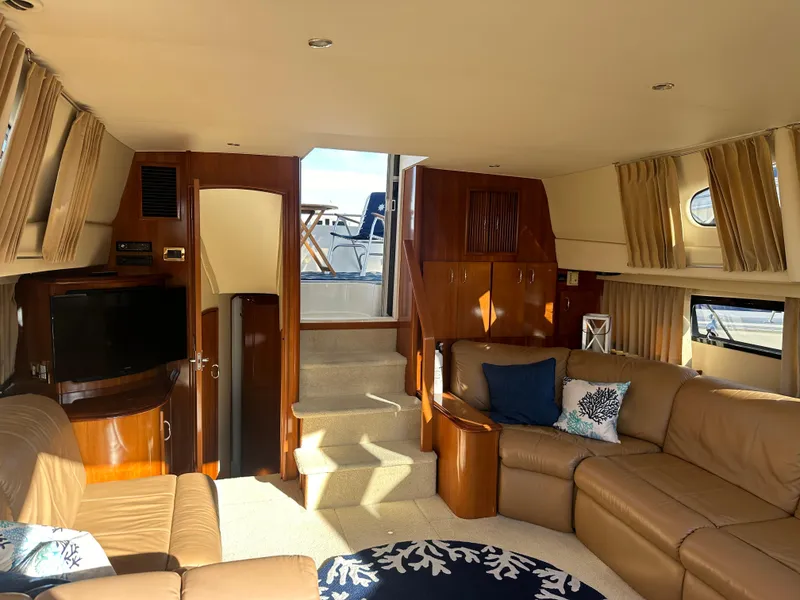 Slide: The Image of Interior of 2004 Carver 396 Motor Yacht with leather sofas and TV. - 11