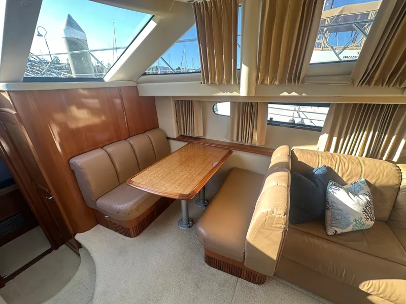 Slide: The Image of Interior of 2004 Carver 396 Motor Yacht with seating area. - 13