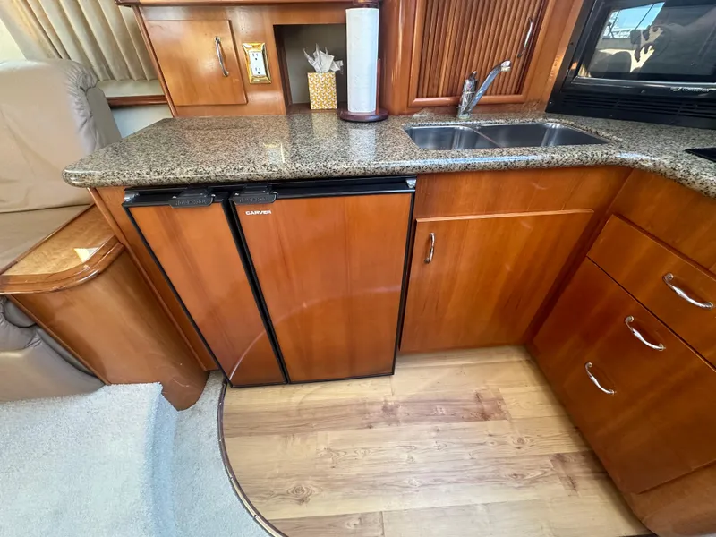 Slide: The Image of Interior of 2004 Carver 396 Motor Yacht with kitchen area. - 16