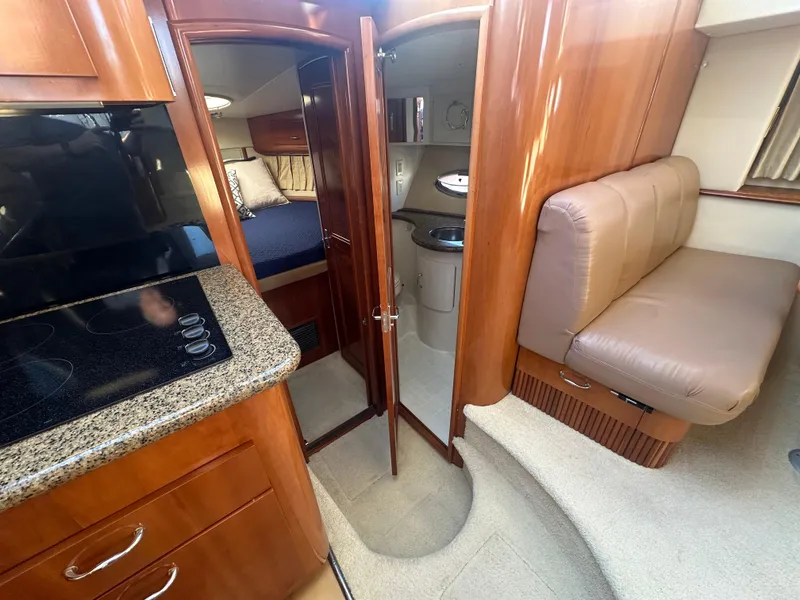 Slide: The Image of Interior of 2004 Carver 396 Motor Yacht with kitchen and seating area. - 17