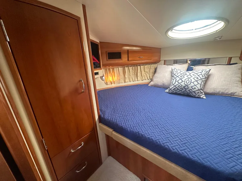 Slide: The Image of 2004 Carver 396 Motor Yacht docked, front view. - 25