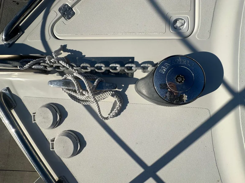 Slide: The Image of Interior of a 2004 Carver 396 Motor Yacht with white leather seating. - 28