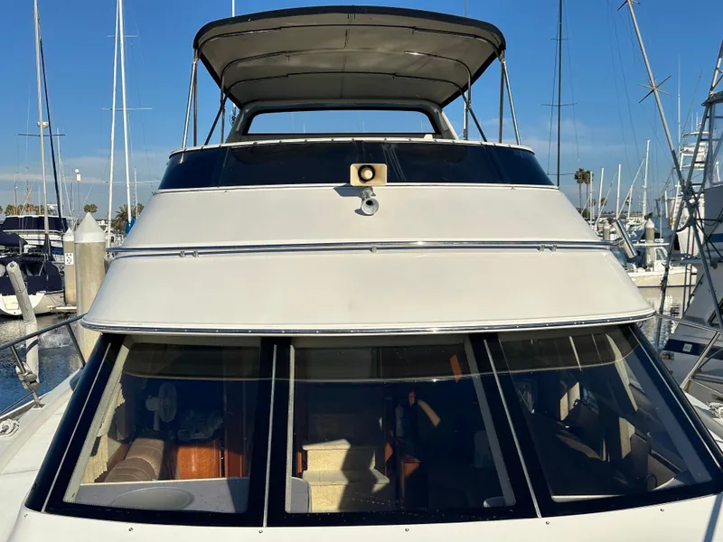 Slide: The Image of Interior of a 2004 Carver 396 Motor Yacht with white leather seating. - 29