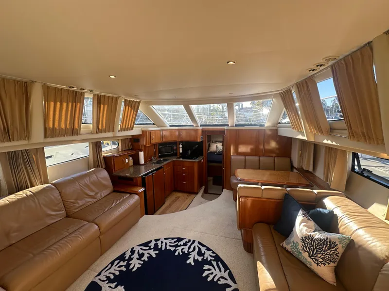 Slide: The Image of Interior of 2004 Carver 396 Motor Yacht with leather sofas and kitchen. - 7