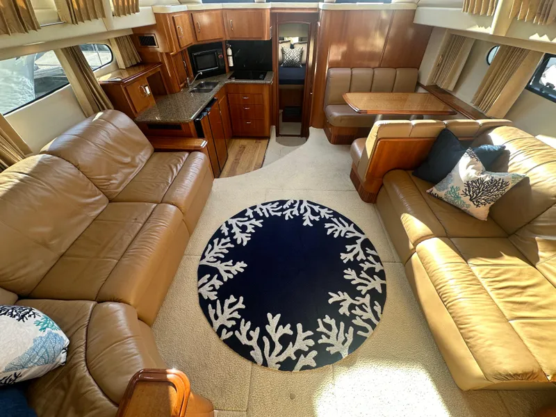 Slide: The Image of Interior of 2004 Carver 396 Motor Yacht with leather sofas and kitchen. - 8