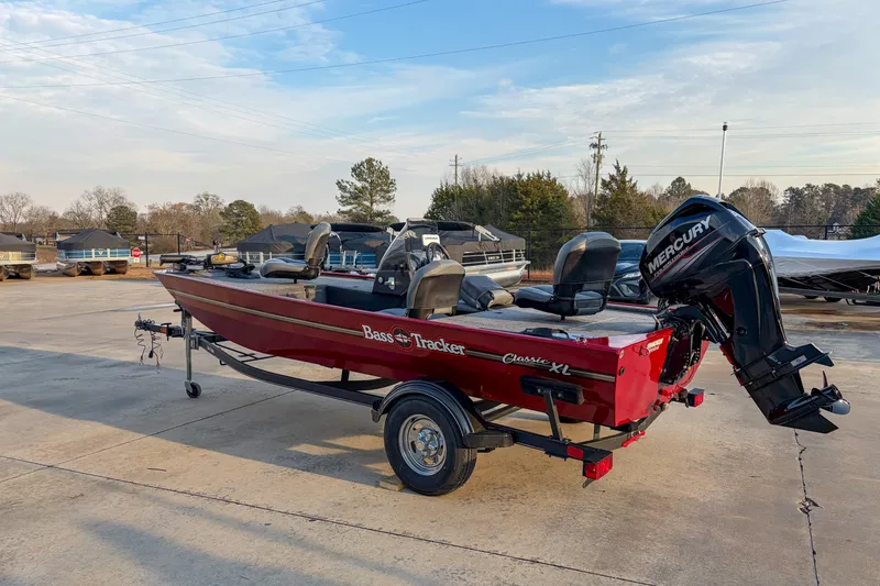Slide: The Image of 2020 Tracker Bass Tracker Classic XL boat with Mercury engine on trailer. - 2