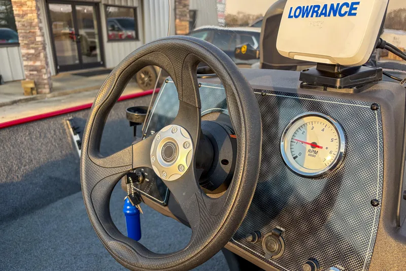 Slide: The Image of 2020 Tracker Bass Tracker Classic XL dashboard with steering wheel and Lowrance device. - 9