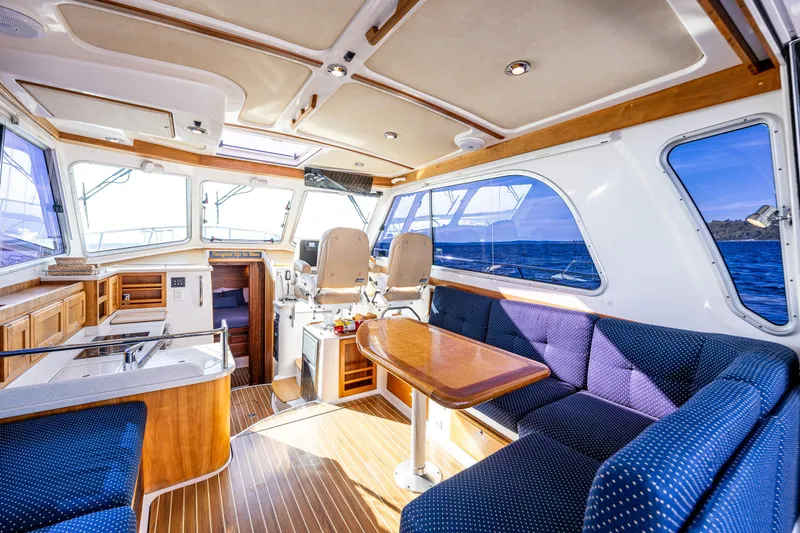 Slide: The Image of Interior of 2013 Back Cove 37 yacht with elegant seating and wooden finishes. - 27