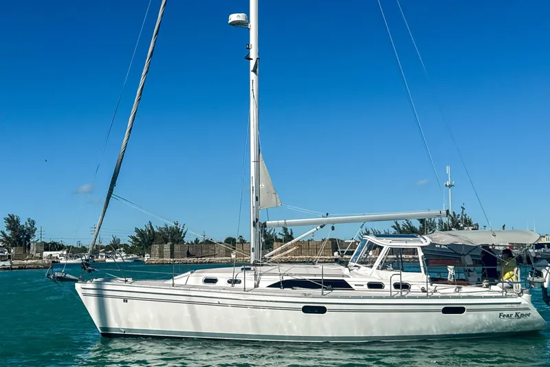 Slide: The Image of 2022 Catalina 385 sailboat docked at marina, showcasing sleek design and modern features. - 10