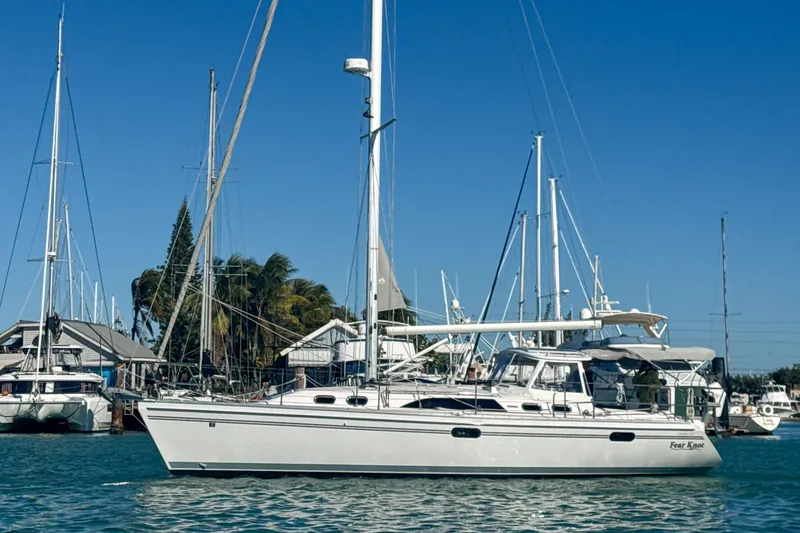 Slide: The Image of 2022 Catalina 385 sailboat deck view at marina, showcasing sleek design and rigging. - 11