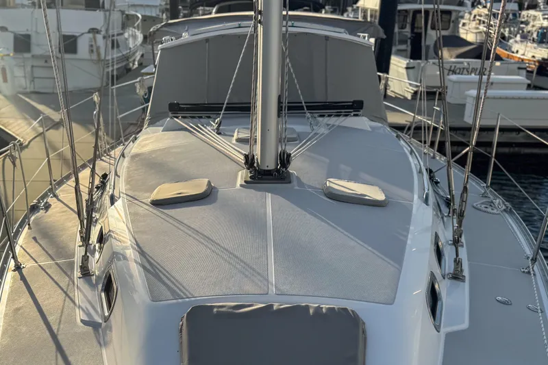 Slide: The Image of 2022 Catalina 385 sailboat on clear blue water under a sunny sky. - 13