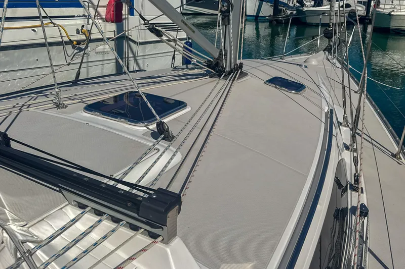 Slide: The Image of Catalina 385 sailboat, 2022 model, docked with safety equipment and motor, named "Fear Knot." - 15