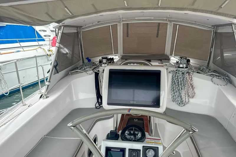 Slide: The Image of Cockpit of 2022 Catalina 385 sailboat with navigation equipment and steering wheel. - 17