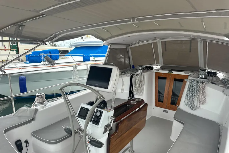 Slide: The Image of Cockpit of 2022 Catalina 385 sailboat with modern navigation equipment and seating. - 18
