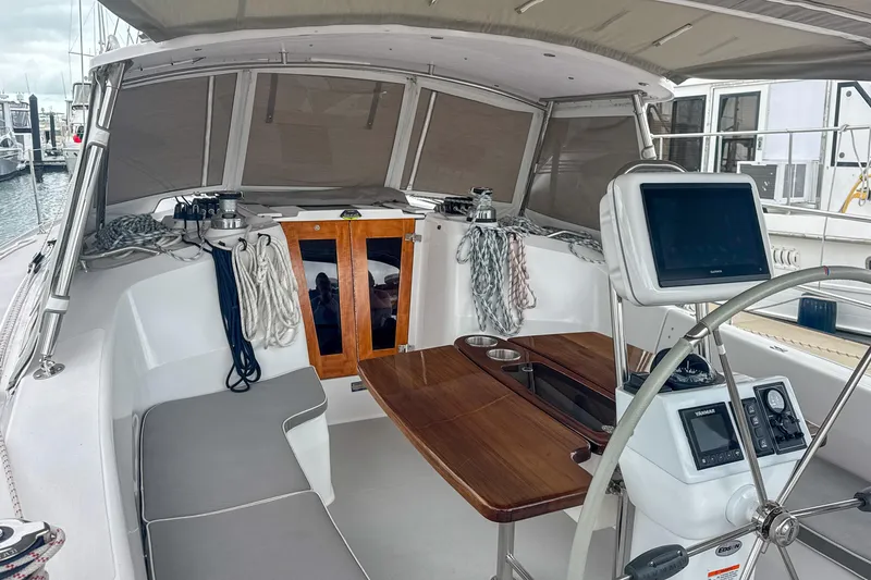 Slide: The Image of Cockpit of 2022 Catalina 385 sailboat with navigation equipment and marina view. - 20