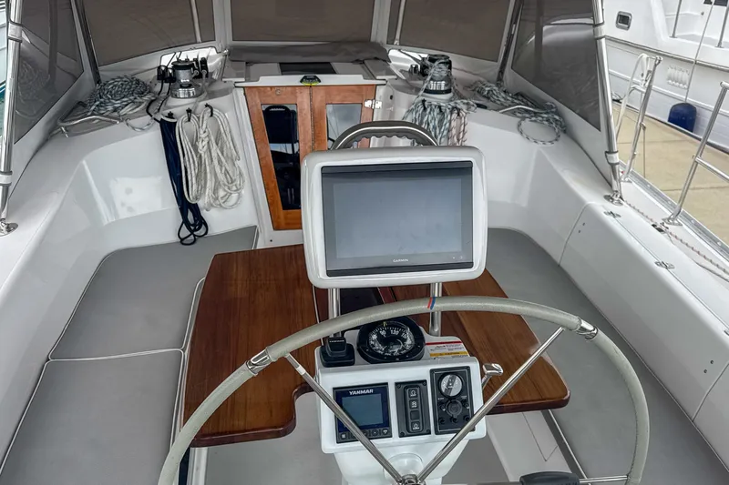 Slide: The Image of Steering wheel and navigation system of 2022 Catalina 385 sailboat cockpit. - 21