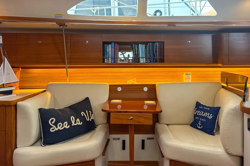 Slide: The Image of Modern kitchen in 2022 Catalina 385 yacht with wood finish and stainless steel appliances. - 28