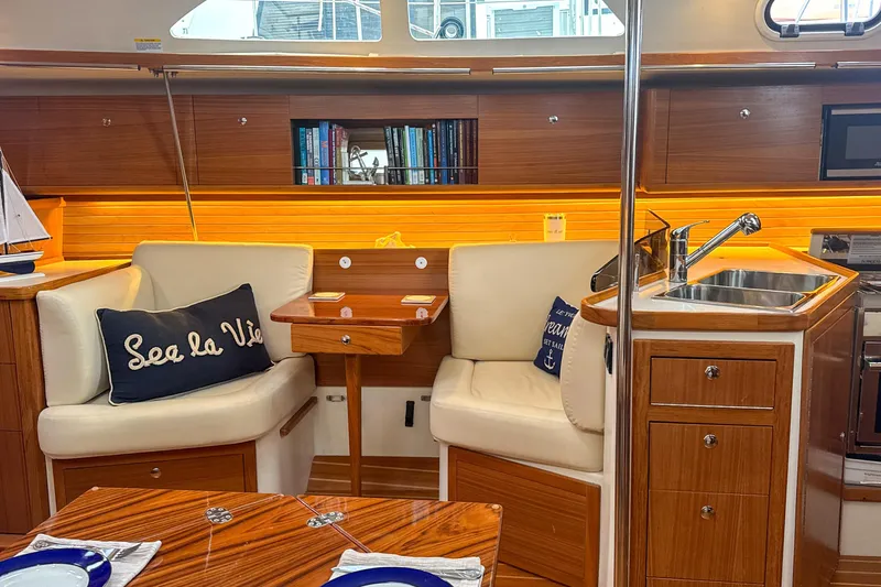 Slide: The Image of Interior of 2022 Catalina 385 sailboat with cozy seating, TV, and nautical decor. - 32