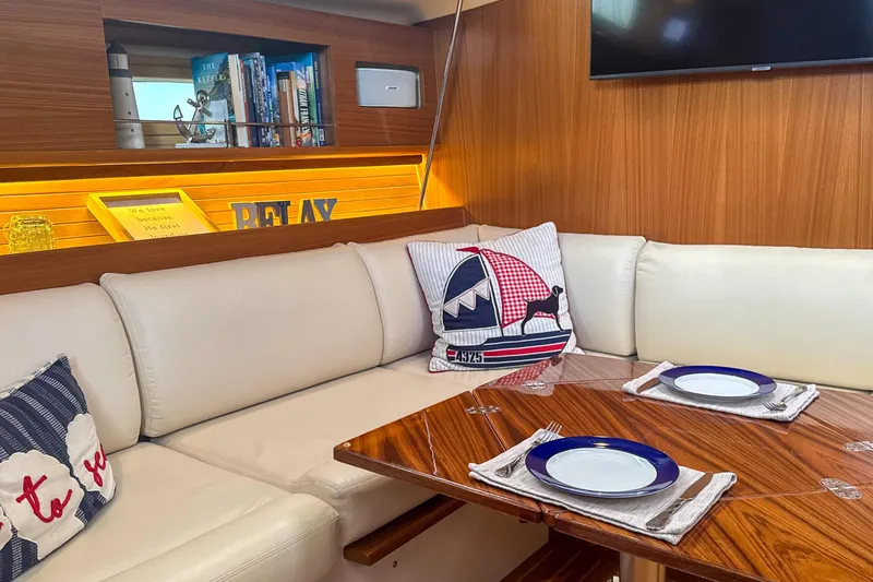 Slide: The Image of Luxurious interior of 2022 Catalina 385 yacht with cozy seating and elegant dining area. - 33